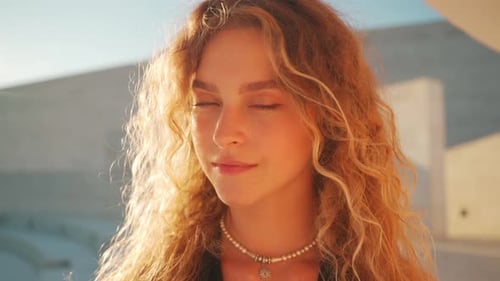 Smiling Young Woman in Golden Hour Lighting