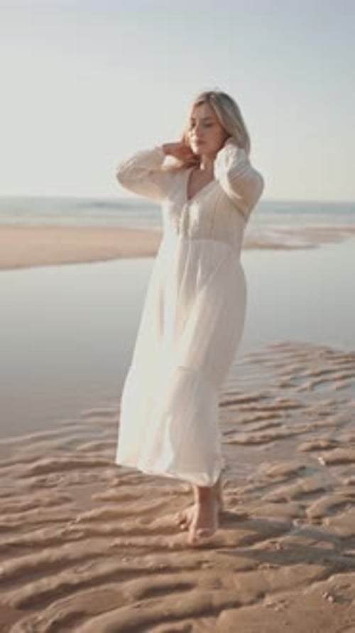 Woman Walking On The Beach