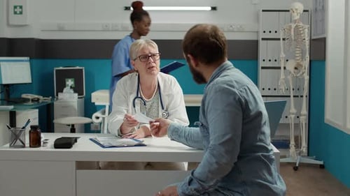 Doctor Consults with Patient in Office