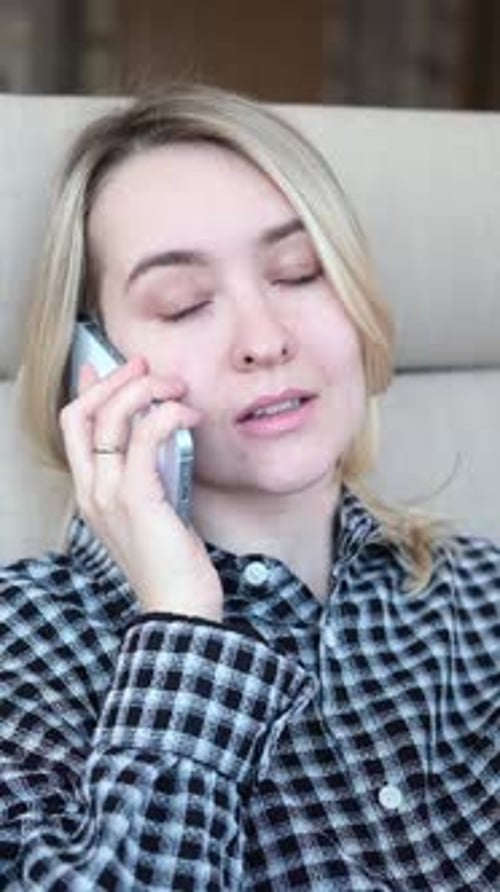 Young Woman with Blonde Hair Talking on Phone