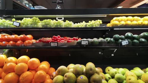Shot of fresh healthy organic fruits and vegetables on shelf at grocery store. Variety of eco-friend