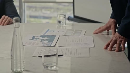 Senior Man Presenting Logistics at Oil Industry Meeting