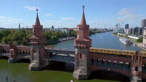subway train Summer day east west Berlin Border River Bridge Germany. Majestic aerial top view fligh