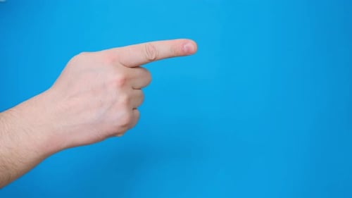 Hand Points Right on Blue Background