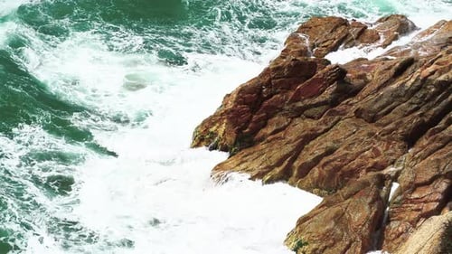 Sea waves impacting against the rocks.