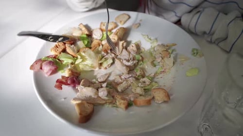 Almost Empty Salad on White Plate Close Up