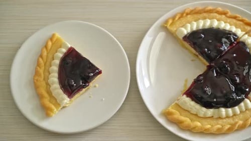 Blueberry Pie with Cream on Plate Close Up