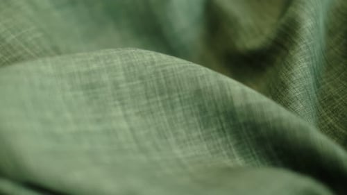 Closeup the Motion Footage Vide Green Linen Textile Abstract Background Clothing Industry Concept