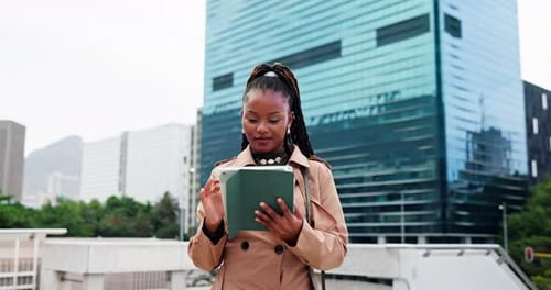 Black woman, walk and typing in city with tablet for real estate research