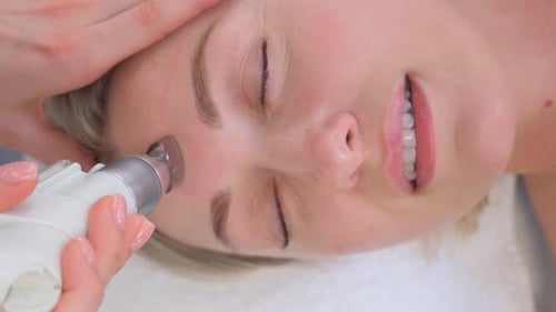 Closeup of a Woman Having a Hydrodermabrasion Facial Peeling Treatment at a Cosmetic Beauty Spa