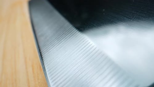 Detailed Close Up of Cleaver Blade on Cutting Board