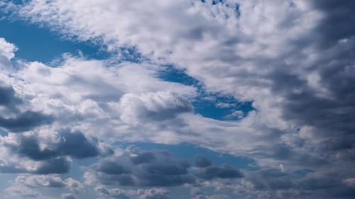 White Clouds Billowing in a Bright Blue Sky