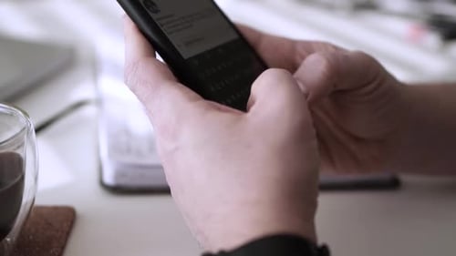 Man scrolling social media in smartphone