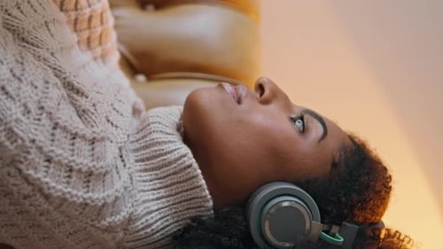 Serene Woman Browsing Tab Screen at Evening Closeup Girl Relaxing Home Vertical