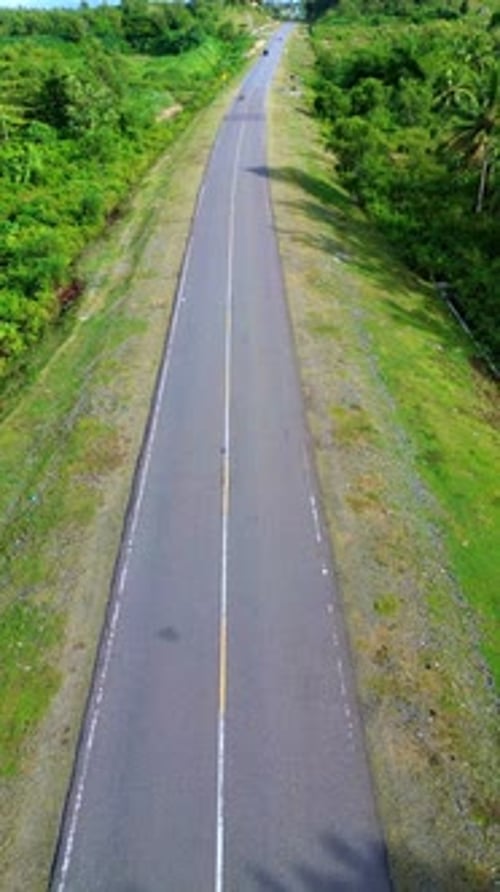 Aerial View of Road Through Green Landscape
