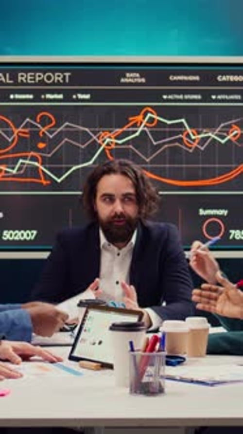 Business Team Discussing Data Analysis in Modern Office