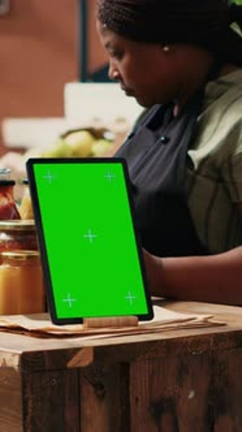 Vertical Video Device Showing Greenscreen Template at Local Supermarket