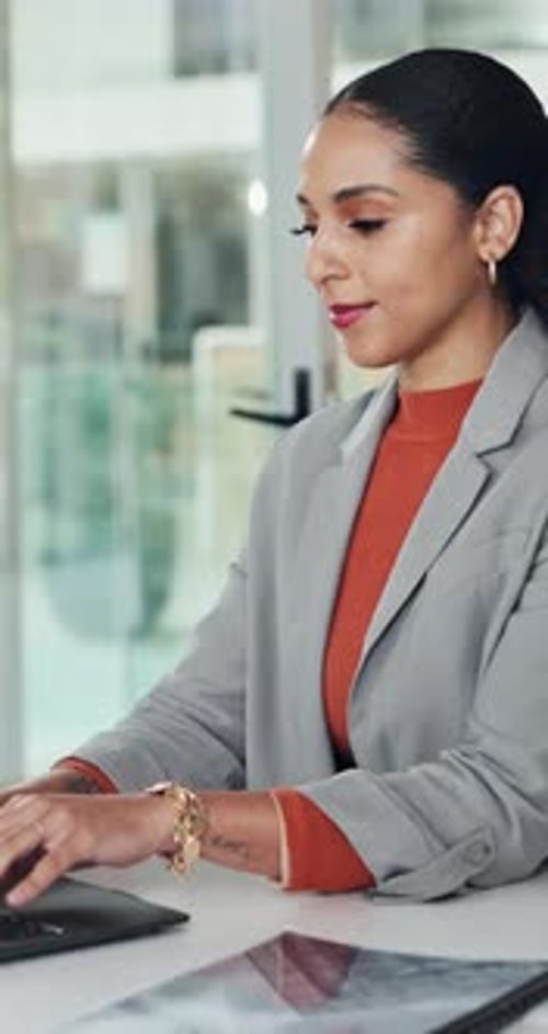 Woman Working on Laptop in Modern Office
