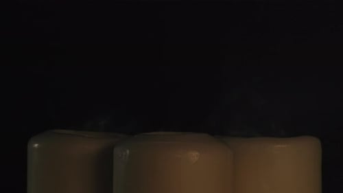 Burning Wax Candles on Black Chroma Key Background