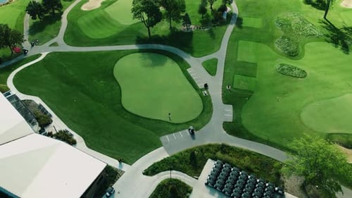 Aerial drone rotating shot over a clubhouse beside a golf course, Northbrook Illinois, USA on a clou