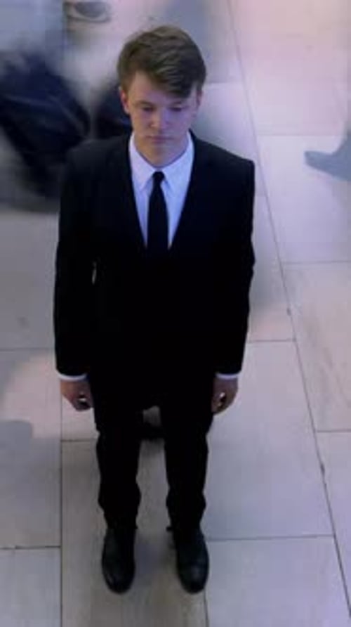 Adult Wearing Suit Standing Still Indoors