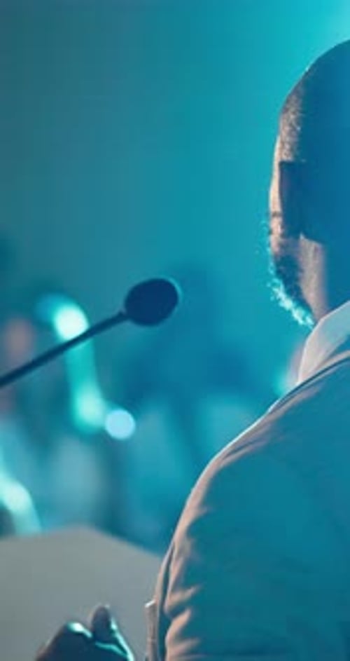 Man Speaking at a Corporate Conference