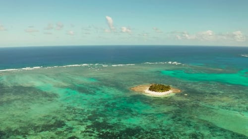 Tropical Guyam Island with a Sandy Beach and Tourists