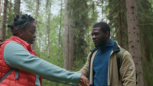 Couple Preparing for Forest Hike with Insect Repellent