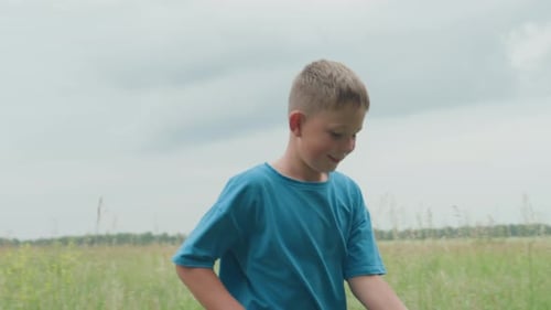 Young Boy Playing Active Young Boy Races Across Vibrant Meadow Under Cloudy Sky Lively Boy Runs