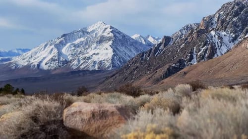 Snow covered Mount Tom Mt Thompson prominent towering peak West Bishop California aerial drone sunri