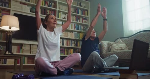 Senior Couple Doing Yoga Together at Home