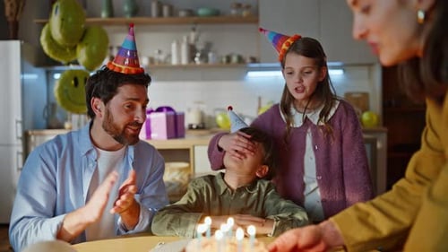Family Celebrating Birthday Video Call in Kitchen