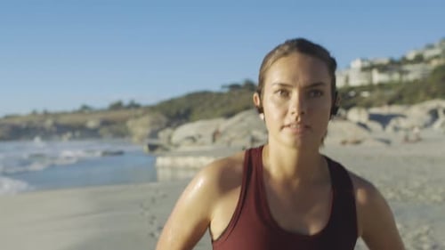 Woman, face or beach running and earphones in workout, training or morning exercise in marathon