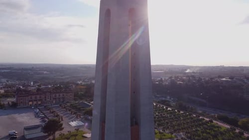 Specttacular vertical drone flight from the Base of Jesus Christ statue in Portugal Lisbon with Sun