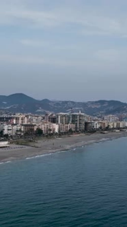 Vertical Video City Magic Aerial View of Urban Panorama at Sunset