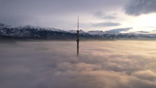 The TV Tower Looks Out of the Clouds at Sunset