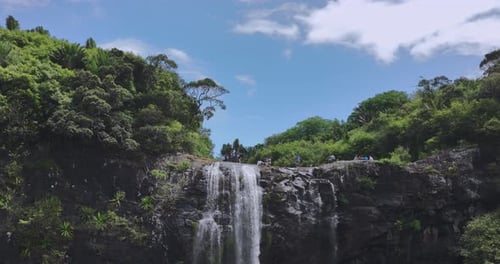 Beautiful Waterfall in Tropical Environment with People