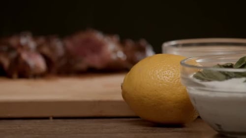 Juicy Steak on Cutting Board with Lemon