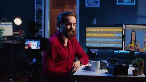 Man Designing Video on Computer and Tablet