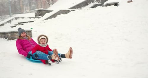 Mother and Little Toddler Boy Son Having Fun in the Snow at Winter Winter Holidays Fun Vacation