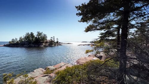 Scenic view of coastline with blue ocean against sky