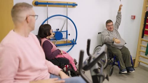People with Disabilities Engaging in Rehabilitation Exercises at the Gym