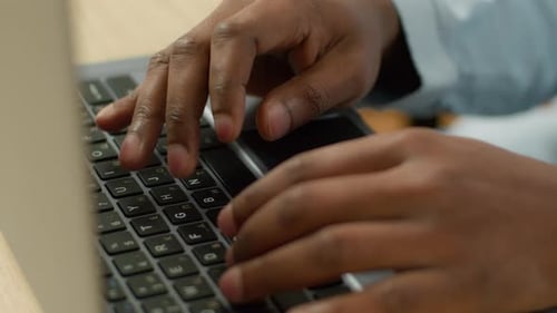Unrecognizable Biracial Businessman Student Working Studying with Computer Pc at Table Close Up Male