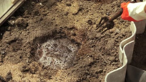 Mixing Soil for Planting with Gardening Tools