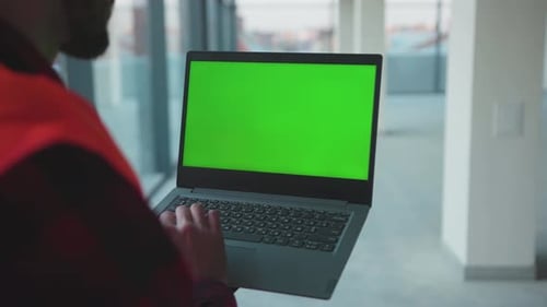 Close Up Hands Engineer Using Laptop Computer with Green Screen Inside Building Worker Project