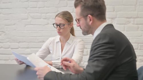 Business People Doing Paperwork in Office