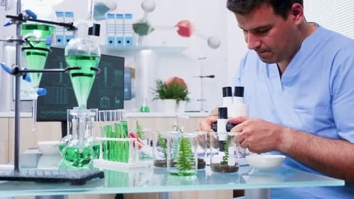 Scientist Examines Plant Sample Under Microscope in Lab