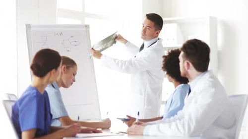 Hospital, Profession, Medical Education, People And Medicine Concept - Group Of Doctors Meeting A...