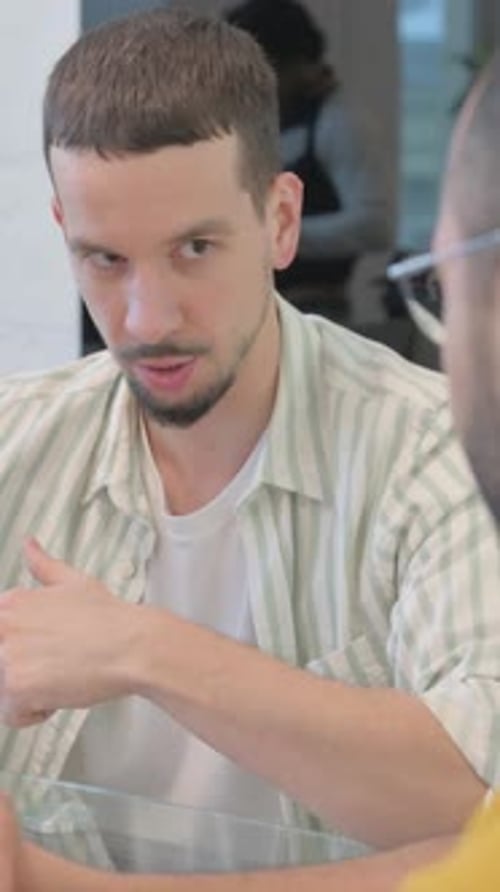 Close up of Creative People Talking at Work, vertical video