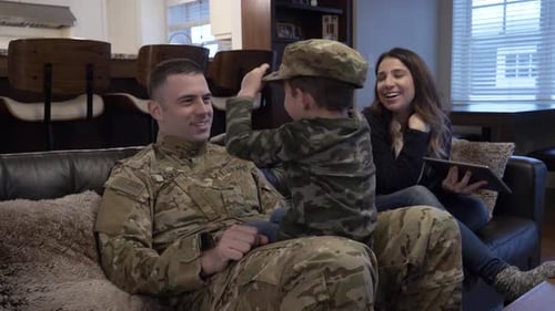 Military Father Returns Home to Family on Couch
